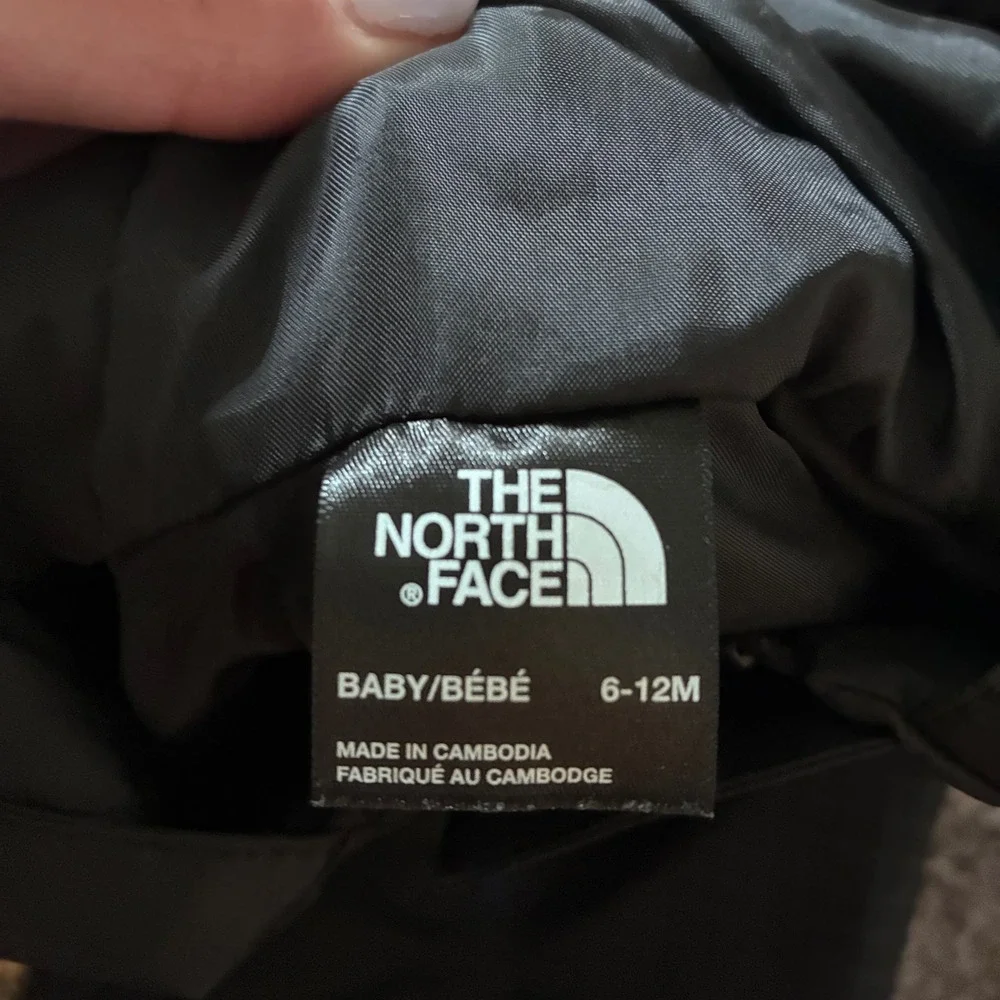 The North Face Baby DryVent Rain Jacket Black Multi Logo Grid Hooded 6-12M